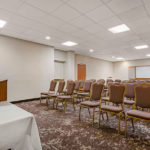 meeting space with rows of chairs facing a podium